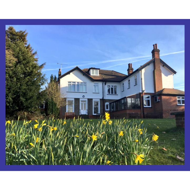 Walsingham House at Abbotswick, A beautiful white house set within fields of flowers.